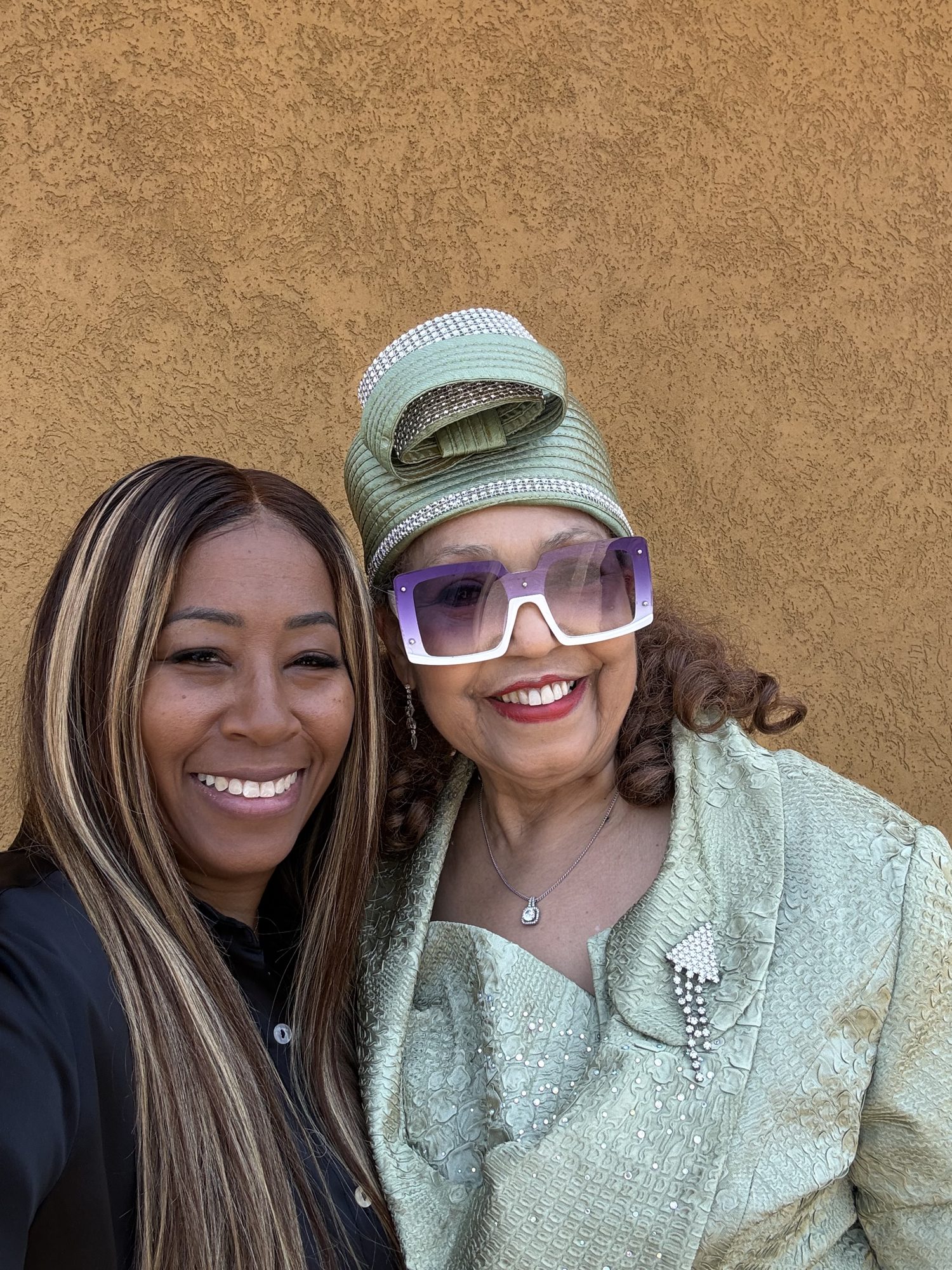 Two smiling members of the Freedom church family