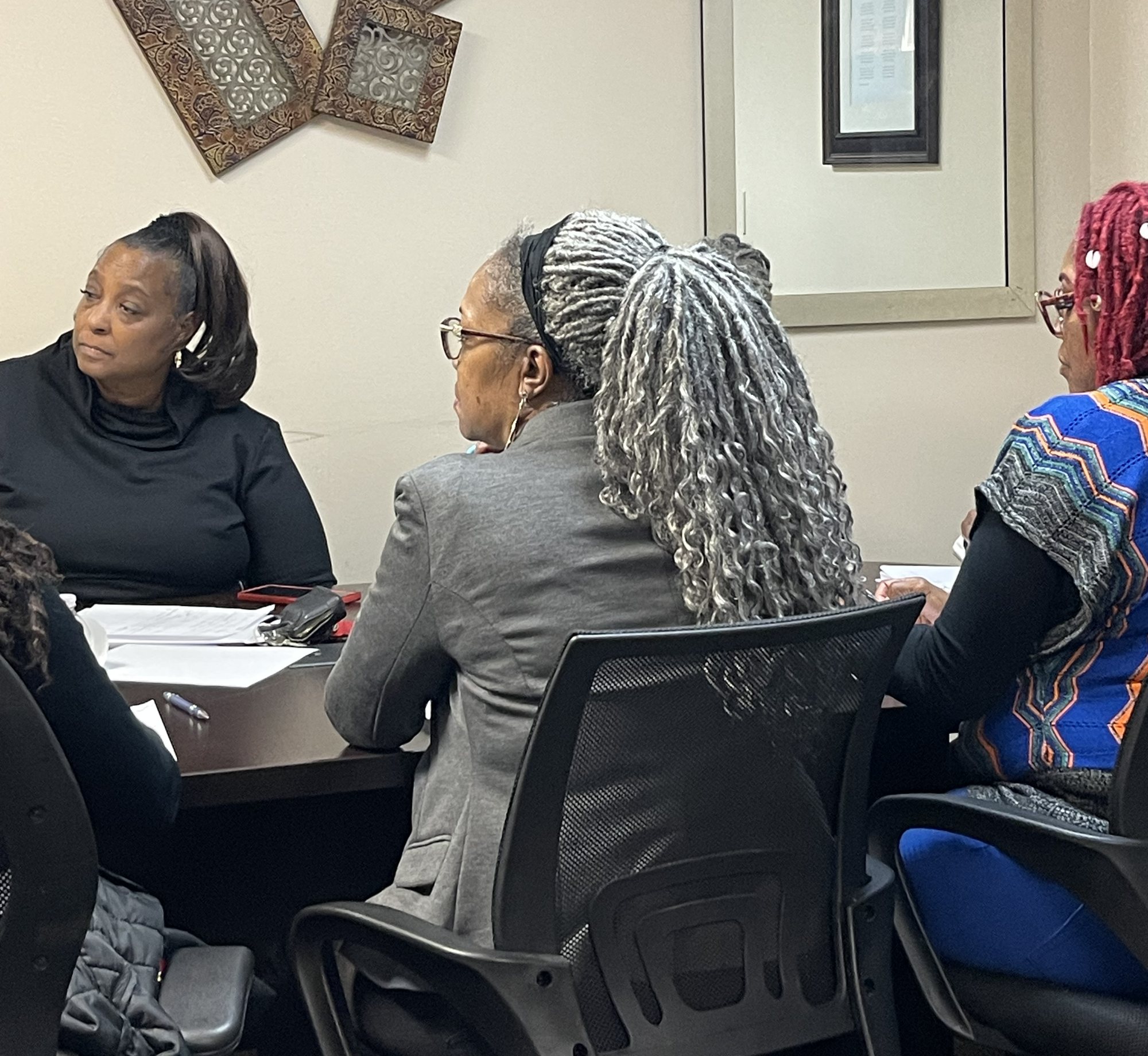 A membership class meeting around the table at Freedom Christian Center